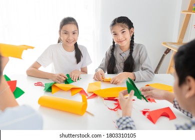 Asian Children Group Learning To Folding Paper In Art Origami Time, They Feeling Fun And Happy, Child Imagine And Development