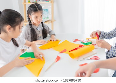 Asian Children Group Learning To Folding Paper In Art Origami Time, They Feeling Fun And Happy, Child Imagine And Development