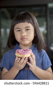 Idnian Little Young Boy Eating Doughnut Stock Photo (Edit Now) 1798840318 picture