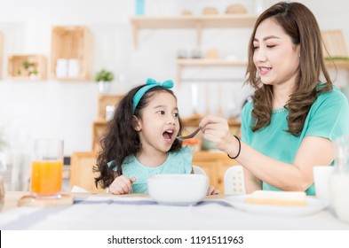 Asian Children And Her Mom Have A Breakfast In The Morning, Child Nutrition And Development, They Feeling Happy In Family Time