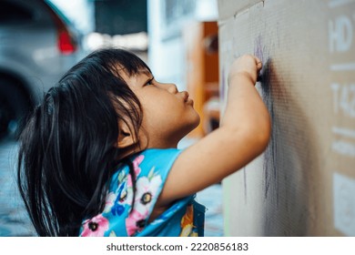 Asian Children Learn To Write, Little Asian Child Drawing At Home