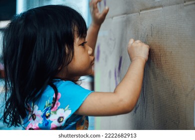 Asian Children Learn To Write, Little Asian Child Drawing At Home