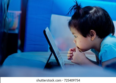 Asian Children Watching Tablet  / Playing Phone And Looking At Cartoon / Kid Play Tablet
