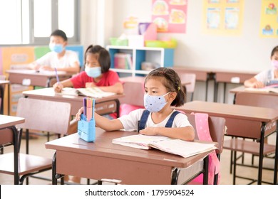 Asian Children Wear Mask To Protection For Coronavirus Covid-19 In The School . Portrait Of Thai Student.Back To School