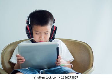 Asian Chinese Boy Playing Tablet, Kid Use Phone And Play Game, Addicted Game And Cartoon, 
