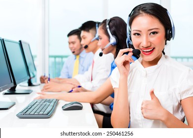 Asian Chinese Call Center Agent Team On Phone