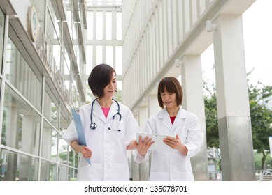 Asian Chinese Doctors Student Have A Discussion