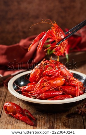 Asian Chinese Food Spicy Crayfish，Crayfish picked up with chopsticks