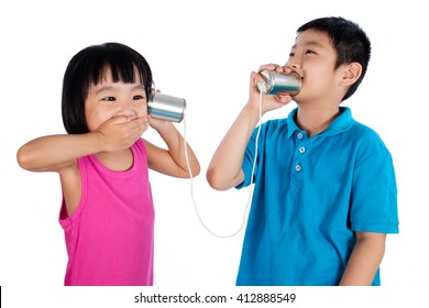 Asian Chinese Kid Playing With Tin Can Phone Isolated On White Background