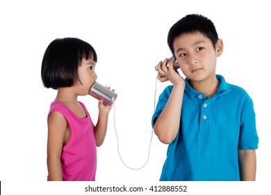 Asian Chinese Kid Playing With Tin Can Phone Isolated On White Background