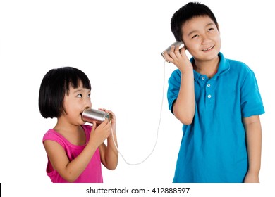 Asian Chinese Kid Playing With Tin Can Phone Isolated On White Background