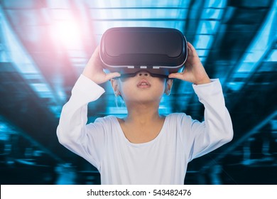 Asian Chinese little girl experiencing virtual reality eyeglassses indoor - Shutterstock ID 543482476