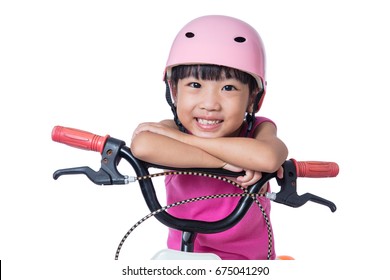 Asian Chinese Little Girl Riding Bicycle In Isolated White Background