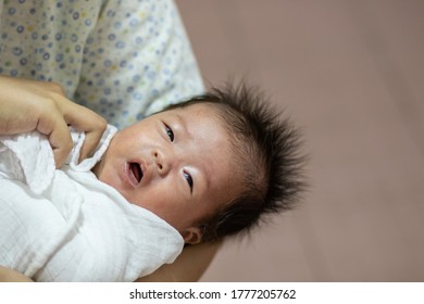 Asian Chinese New Born Baby Boy Having A Bath By Mother