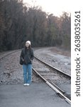 Asian chinese woman by train tracks during fall in fredericksburg virginia