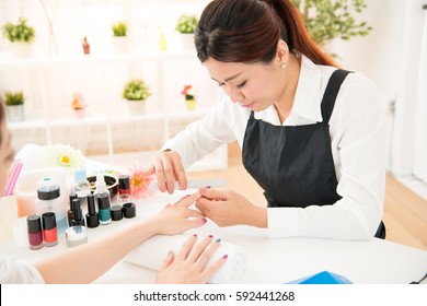 asian chinese women hands receiving a manicure. nail filing close up selective focus of nail salon, spa treatments. beauty and fashion concept. - Powered by Shutterstock