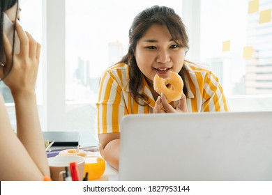 Asian Chubby Woman Enjoy Unhealthy Eating Sweet Dessert Donut With Friends In Office.