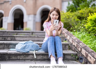 Asian College Student Use Mobile Smartphone Happily On Campus