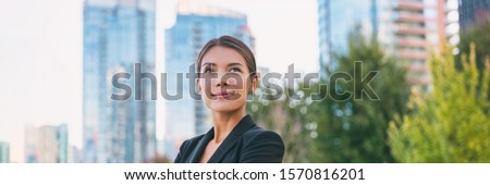 Asian confident business woman looking up to the bright future of her career opportunities. Job, work aspirational banner panorama background. Businesspeople lifestyle.