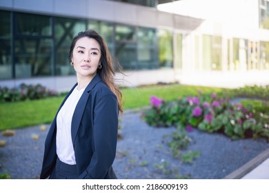 Asian Confident Business Woman In Suit. Bright Future Of Career Opportunities Concept. Job, Work Aspirational Banner, Spring Background Of Office Center. Business People Lifestyle. Copy Space