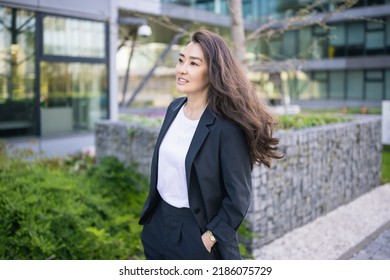 Asian Confident Business Woman In Suit. Bright Future Of Career Opportunities Concept. Job, Work Aspirational Banner, Spring Background Of Office Center. Business People Lifestyle. Copy Space