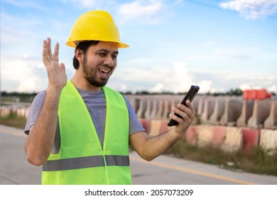 Asian Construction Worker Using Smartphone For Video Call In Construction Site