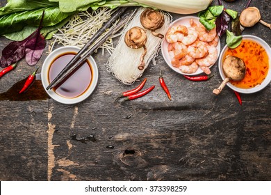 Asian Cooking Ingredients With Soy And Sweet-sour Sauce And Chopsticks On Rustic Background, Top View. Asian Food Concept.