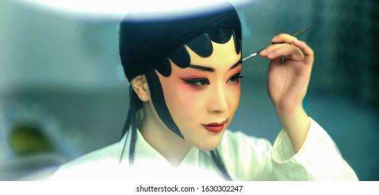 Asian costume Peking opera actor performing makeup