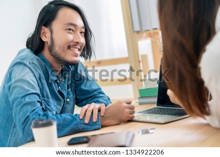 asian couple coworker work ay home with laptop home background
