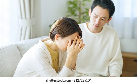 Asian Couple Depressed At Home