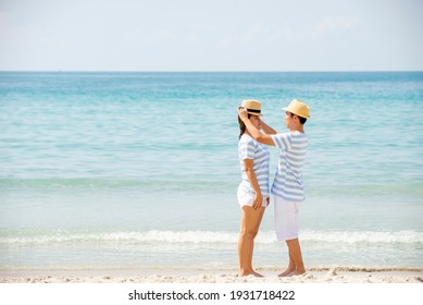 Asian Couple  Enjoy On The Beach Together , Relax Woman With Man  On Beach , Travel Holiday  Summer  Family Healthy Concept , Banner For Text