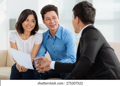 Asian Couple At Financial Planning Consultation