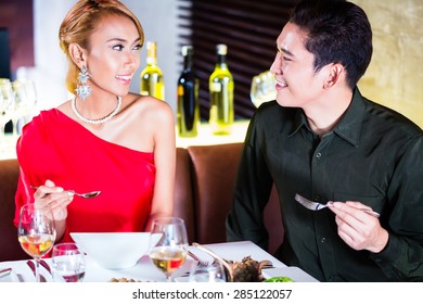 Asian Couple Fine Dining In Fancy Restaurant