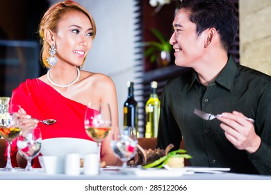 Asian Couple Fine Dining In Fancy Restaurant