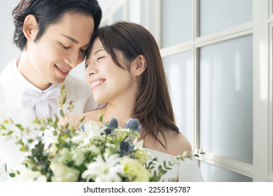 Asian couple getting married. Bridal photo. Photo wedding. Photo studio. - Powered by Shutterstock