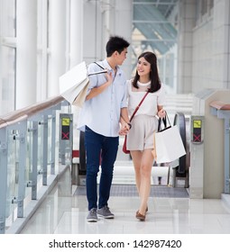 Asian Couple Go Shopping Together.