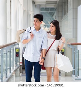 Asian Couple Go Shopping Together.