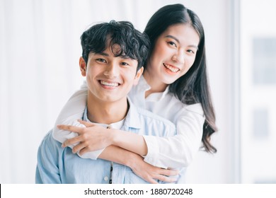 Asian Couple Happily Embracing Each Other
