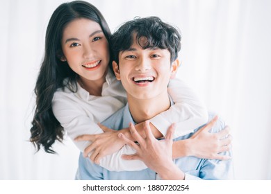 Asian couple happily embracing each other
 - Powered by Shutterstock