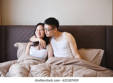 Asian couple are happy on bed, living together in luxury bedroom