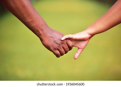 Asian Couple Holding Hands And Walking Away 