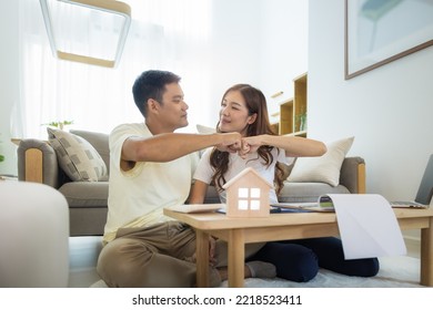 Asian couple in home or house. To bump punch, compare prices, interest, credit and calculate together. Include laptop, calculator and document on table. Concept for marriage, family, loan, finance.
 - Shutterstock ID 2218523411
