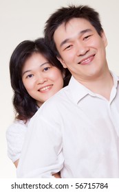 Asian couple hugging white shirt on white background - Shutterstock ID 56715784