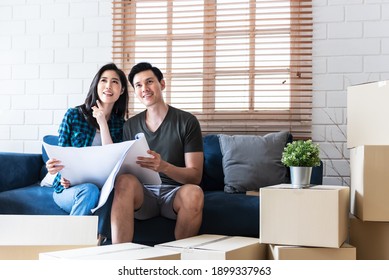 Asian Couple, Husband And Attractive Wife Looking And Discuss About Renovating The Old House To Be New Home, To People, Real Estate And Renovation Concept.