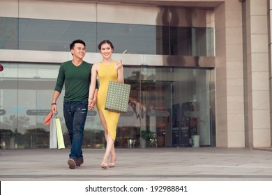 Asian Couple Leaving Store