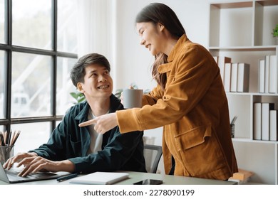 Asian couple looking laptop with happy together in the home. Success of lovers in front of a notebook. Happy couple on social online with a laptop. - Shutterstock ID 2278090199
