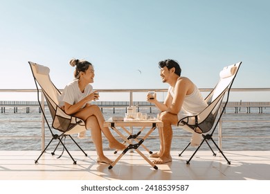 Asian couple lover enjoy their holiday at the sea in the summer with beautiful clear sky ocean. - Powered by Shutterstock