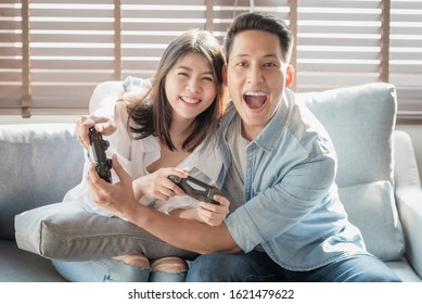 Asian Couple Lovers Enjoy And Play Console Game On Vacation Make More Quality Time Of Happiness Together At Home