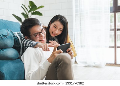 Asian couple man and woman talking working  spend time together at home, Asian couple family lifestyle concept