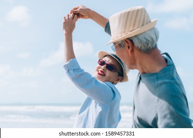 Asian Couple Senior Elder Dancing Retirement Resting Relax At Sunset Beach Honeymoon Family Together Happiness People Lifestyle